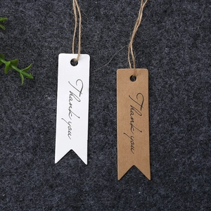 Brown and white kraft paper thank you gift tags with swallowtail design and twine strings