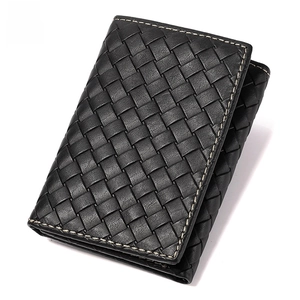 Detail of black woven leather tri-fold wallet with RFID blocking technology logo