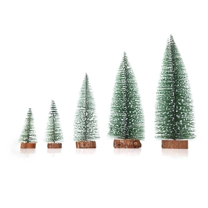 Miniature snow-flocked pine Christmas trees set with wooden bases for desk decoration