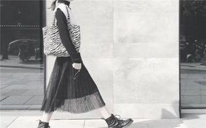 Street style shot of a zebra pattern canvas tote bag for women in a modern urban setting