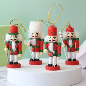 Detail view of 4-piece red and green wooden nutcracker soldier Christmas tree ornaments