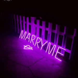 Purple LED 'MARRY ME' neon sign with heart for romantic wedding and proposal decor