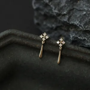 S925 sterling silver 14K gold drop earrings with diamond flowers on stone tray