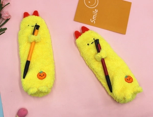 Cute yellow plush pencil cases with embroidery and soft texture on pink background