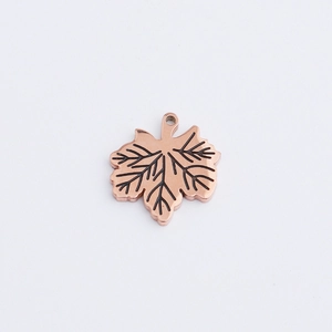 Detailed view of rose gold maple leaf charm with vein texture for DIY jewelry making