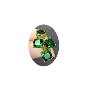 Elegant gold earrings with square-cut green emerald-style gemstones in a four-claw setting