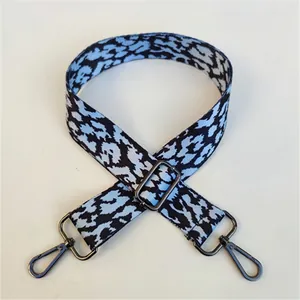 Adjustable leopard print bag strap in blue and black with gunmetal swivel hooks