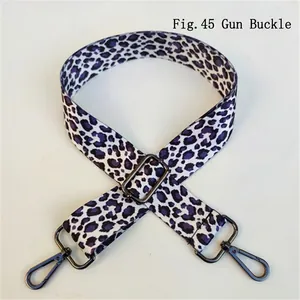 Detail of purple leopard print strap with gunmetal buckle and lobster clasp for bags