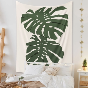Bohemian tapestry with green monstera leaf pattern on cream fabric for bedroom decor