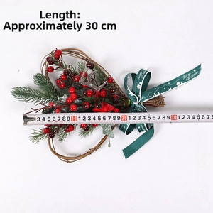 Detailed 30cm Christmas wreath featuring red berries and pine needles on a heart frame