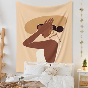 Modern bohemian wall tapestry with female silhouette art in a cozy bedroom setting