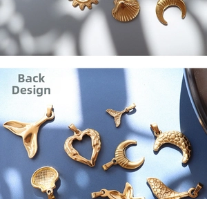 Macro view showing the textured back of gold-plated moon and starfish pendants
