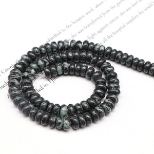 Detailed view of dark green mottled abacus beads for DIY natural stone jewelry making