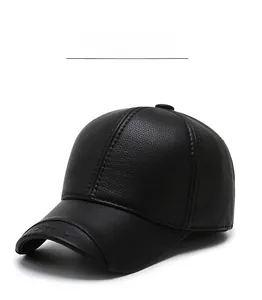 Close-up of black faux leather baseball cap showing textured six-panel design and top button