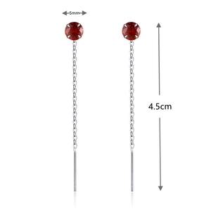 Detail view of S925 silver long tassel earrings featuring 5mm red stones and 4.5cm length