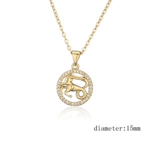 Macro detail of gold Capricorn constellation pendant with 15mm diameter and zircons