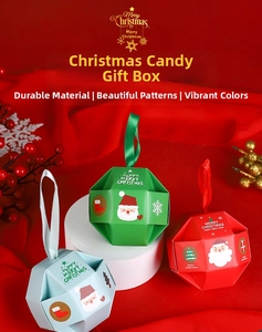 Detail of colorful geometric Christmas candy gift boxes with festive patterns and silk handles