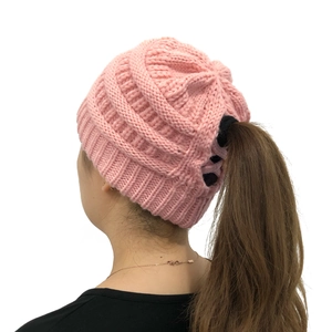 Pink knit ponytail beanie for women with back opening for hair in winter