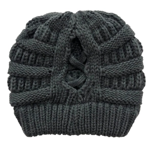 Close-up of dark grey chunky knit beanie featuring a functional ponytail opening design