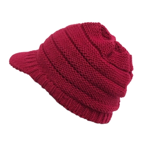 Detail view of burgundy winter knit visor hat with thick wave patterns and fleece lining