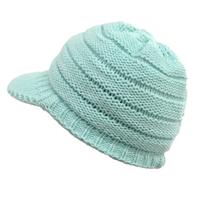 Detail showing the light blue chunky knit texture and protective visor of the winter hat