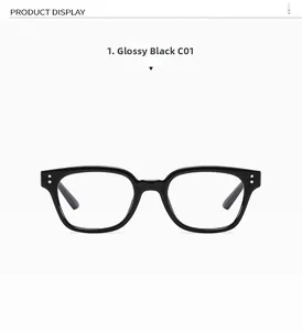 Detail shot of glossy black eyewear frames with silver dot accents and C01 marking