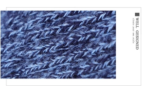 Macro detail of blue knitted fabric texture showing premium yarn and soft fiber finish