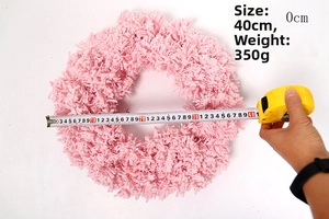 Pink flocked Christmas wreath with a 40cm diameter size measurement and 350g weight