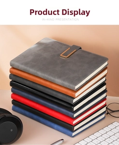Detailed view of executive A5 faux leather notebooks with U-shaped magnetic buckles in six colors