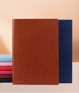 Detailed view of premium PU leather notebooks in various colors with elegant textures