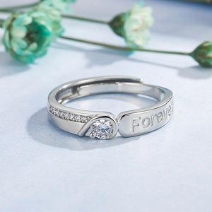 Polished silver couple ring with Forever engraving and sparkling cubic zirconia heart
