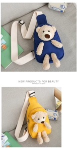 Close-up of cute cartoon bear canvas chest bags in blue and yellow on a gray sofa