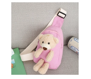 Close-up of pink canvas kids chest bag featuring a 3D plush teddy bear and adjustable strap