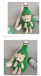 Detail of green canvas kids chest bag with cute plush bear and adjustable white strap