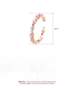 Detail view of star-shaped rose gold copper ring with cubic zirconia, weighing 1.2g