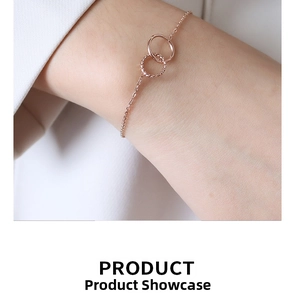 Close-up of rose gold interlocking double circle bracelet with twisted rope detail