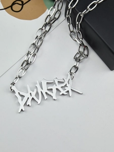 Detailed close-up of retro silver stainless steel double layer necklace with DANGER pendant