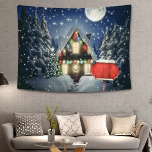 Detailed view of Christmas tapestry featuring a snowy forest and cozy cabin on a grey wall