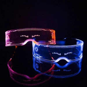 Close-up of LED glowing cyber glasses with futuristic etching and colorful light effects