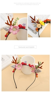 Close-up details of Christmas reindeer antler headband with festive flowers and pine cones