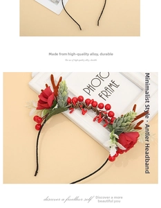 Detail of Christmas reindeer antler headband with red roses, berries and alloy frame