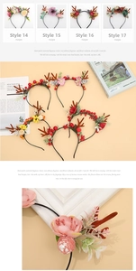 Detail of Christmas reindeer antler headbands with pine cones and berries decoration