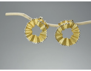 Detailed view of creative S925 sterling silver earrings shaped like pencil shavings