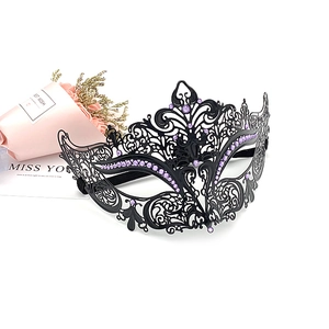 Detailed laser-cut black metal masquerade mask with purple rhinestones and elastic strap