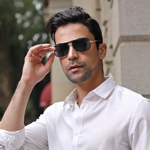 Classic silver metal aviator sunglasses with dark grey lenses worn by a male model