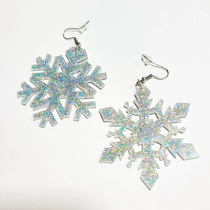 Silver hook earrings with iridescent acrylic snowflake pendants and glittering finish
