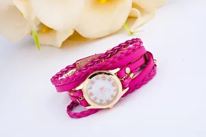 Close-up of rose red triple wrap bracelet watch with woven rope and golden round case