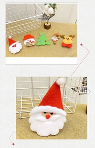 Macro detail of plush Santa Claus and festive ornaments set with golden hanging cords