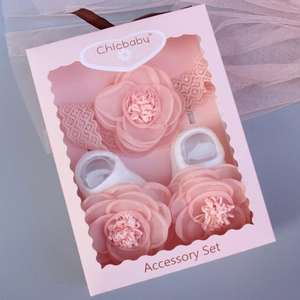 Pink lace headband and matching baby socks set presented in a stylish window gift box