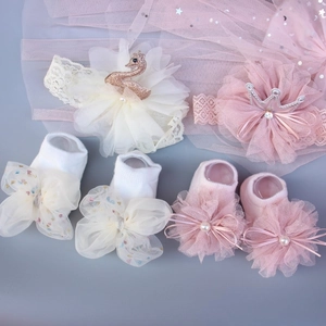 Infant headbands and socks set with swan crown designs and lace details in pink and cream